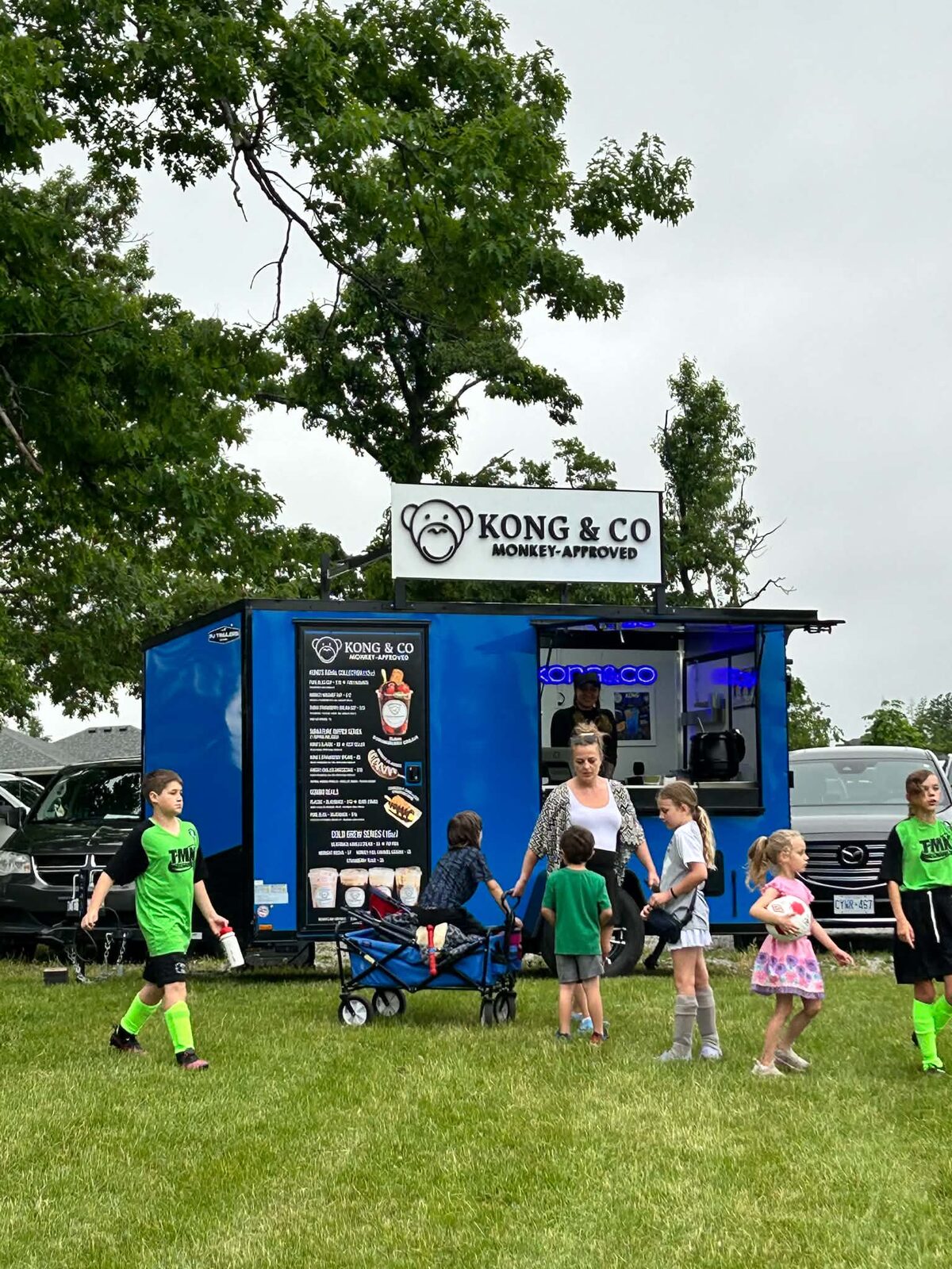 Kong&Co blue trailer serving a busy outdoor event